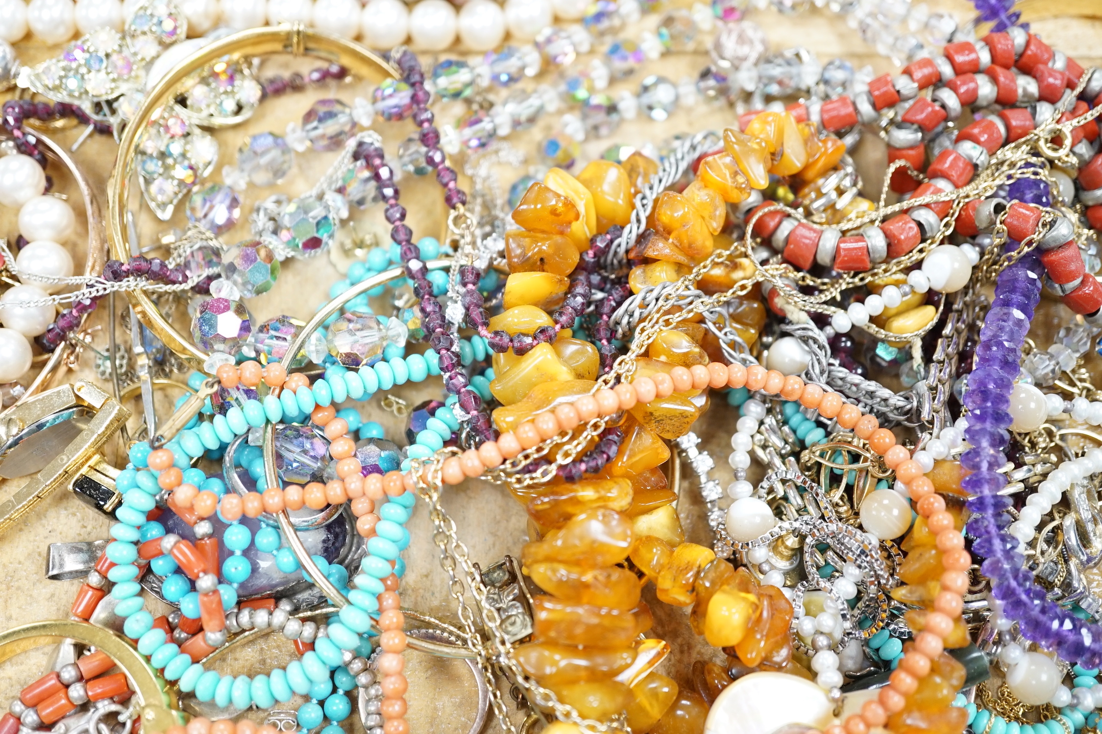 Assorted costume jewellery including amber necklace, coral necklace, cameo shell bracelet etc.